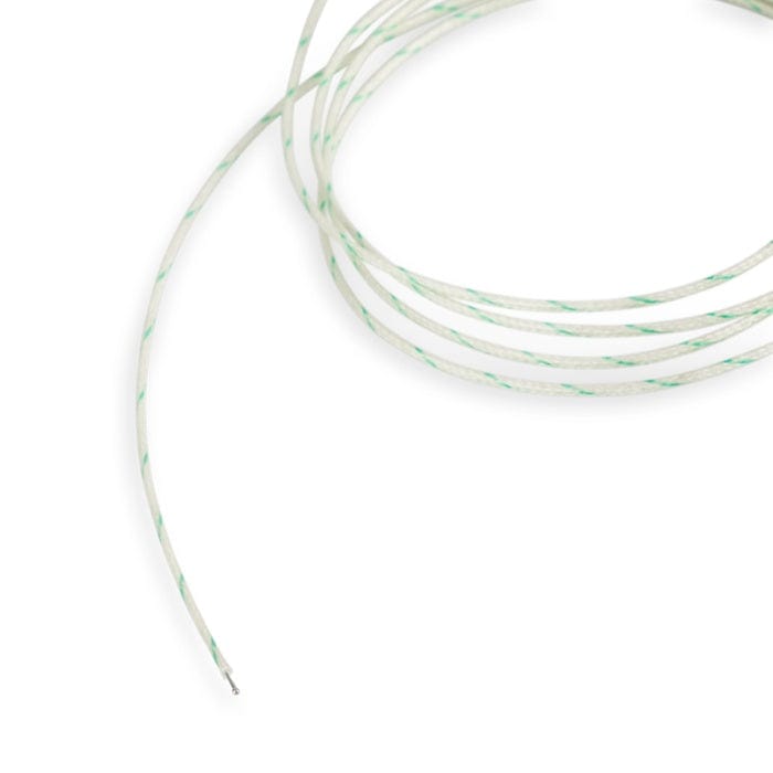 Une sonde de température de four en fibre de verre sur fond blanc. (Thermomètre.fr)