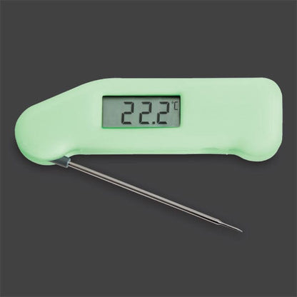 Un termometro digitale Thermometer.fr verde su sfondo nero.